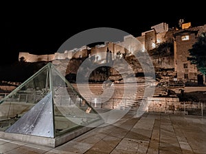 Night photo of Castle of Gibralfaro in Malaga city with a Roman theatre