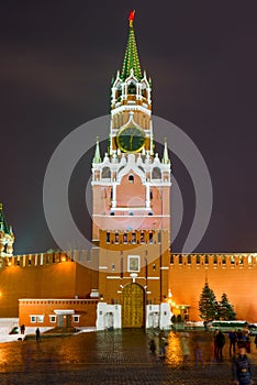 Night photo of the Kremlin`s Spassky tower with chiming clock in photo