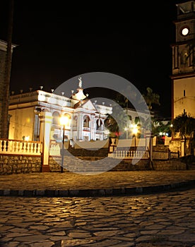 Night photography center of the magical town Cuetzalan Pueblo with view of the government palace, kiosk and the church of San Fra