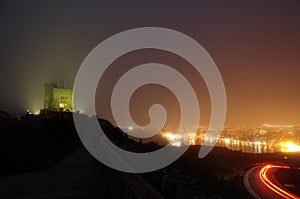 Night photography of roadway up Signal Hill and St. John`s Harbo