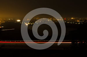 Night photography of roadway up Signal Hill and St. John`s Harbo