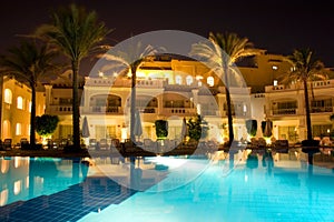 Night pool side of rich hotel