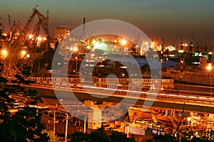 Night port scene with cranes