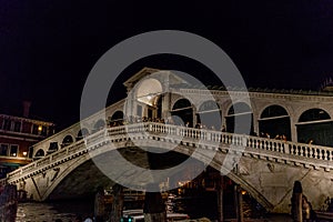 Night at Rialto bridge over the grand canal in Venice, Italy