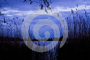 Night river with blue sky and clouds