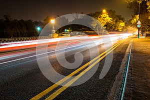 Night road in the city with car the light trails