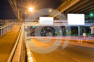 Night road long exposure with blank billboard