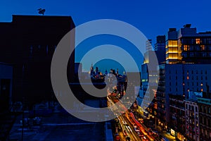 Night scene Bowery Street New York city with car lights trails