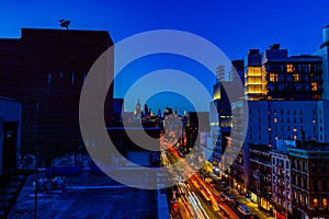 Night scene Bowery Street New York city with car lights trails.