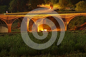 Night scene of bridge and people camping place