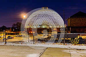 Night scene of the Desert Dome, with the moon riding on the side, at Henry Doorly Zoo Omaha Nebraska.