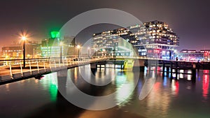 Night scene with modern architecture in the mist