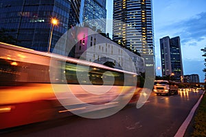 Night scene of modern city with light trails.