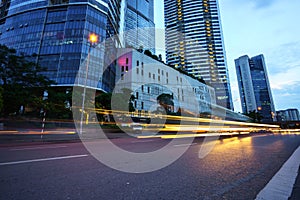 Night scene of modern city with light trails.