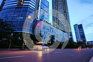 Night scene of modern city with light trails.