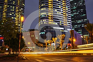 Night scene of modern city with light trails.