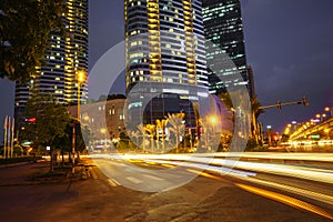 Night scene of modern city with light trails.