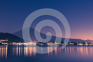 Night scene of Mt fuji and the city around kawaguchi lake, japan