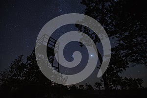 Night scene, observation tower on the Seli swamp under the starry sky