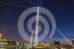 Night scene of Omaha Kerrey suspension bridge tower with suspension cables with beautiful sky colors just after sunset