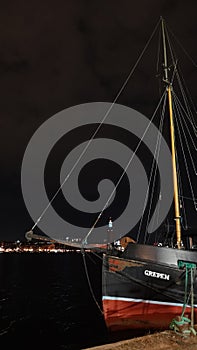 Night scene panorama of ship and Stockholm City Hall in Sweden