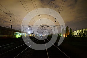Night scene of rails and train in Carpati station, Bucharest, CFR photo