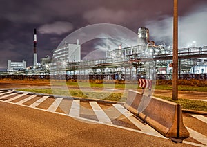 Night scene with road and petrochemical industry on the background