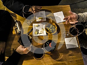 Men Drinking Wine at Bar photo