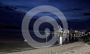 night scene at traditional fishing jetty photo