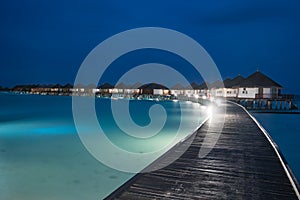 Night scene of typical luxury overwater villa