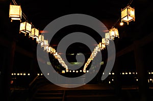 Night scene of votive lanterns at Japanese temple