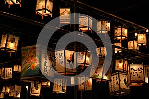 Night scene of votive lanterns at temple, Japan.