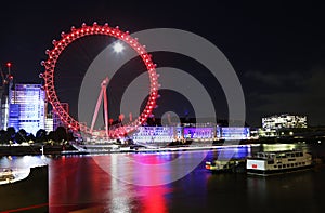 Night scenery of London Eye - a giant ferris wheel on the South Bank of the river Thames London United Kingdom