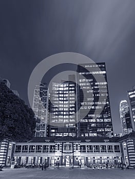 Night scenery of old and modern high rise buildings in Hong Kong city