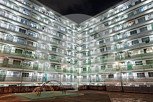 Night scenery of playground and residential building of public estate in Hong Kong city