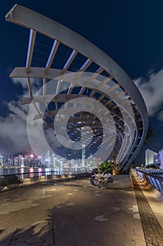 Night scenery of promenade of Victoria harbor of Hong Kong city