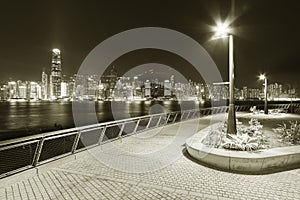 Night scenery of seaside promenade of Victoria harbor of Hong Kong city