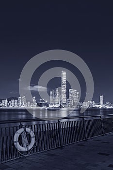 Night scenery of seaside promenade of Victoria harbor of Hong Kong city