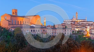 Night scenery of Siena, a medieval town in Tuscany Italy, with view of the Dome & Bell Tower of Siena Cathedral  Duomo di Siena