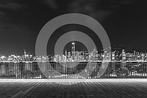 Night scenery of Victoria harbor of Hong Kong city in monochrome