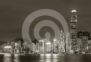 Night scenery of Victoria harbor of Hong Kong city in monochrome