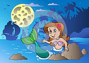 Night seascape with swimming mermaid