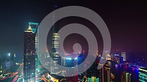 Night shanghai city downtown buildings roof top panorama 4k time lapse china