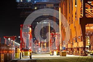 Night shift in container terminal harbor