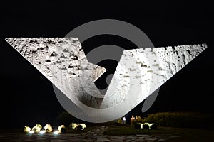 Night shot of Broken wings monument