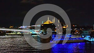 Night shot of Golden Horn Metro Bridge or Halic Bridge overlapping Suleymaniye Mosque, Istanbul, Turkey