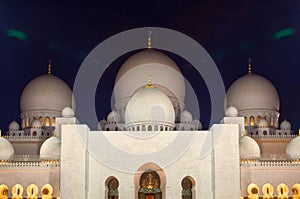 Night Shot of Illuminated Zayed Mosque in Abu Dhabi with White Marble Domes