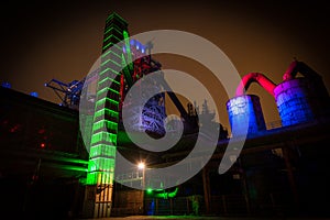 Night shot of Landschaftspark Nord, old illuminated industrial ruins in Duisburg, Germany photo