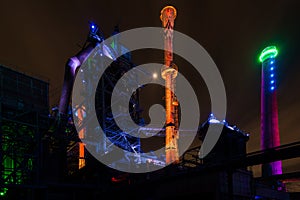 Night shot of Landschaftspark Nord, old illuminated industrial ruins in Duisburg, Germany photo