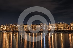 A night shot of Prague from Slavonic Island over Vltava and towards Smichov and JirÃ¡sek Bridge - Jiraskuv most